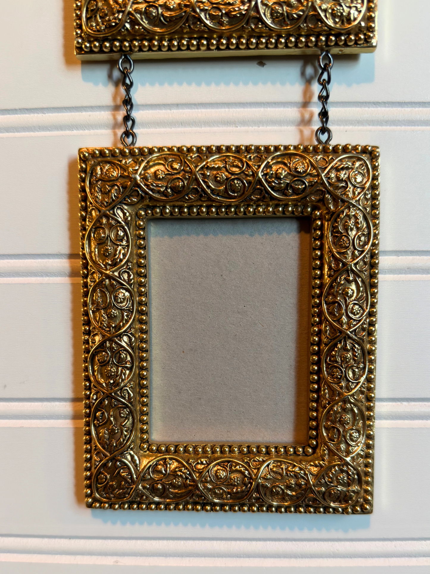 Gold Ornate Frames Connected By Chain