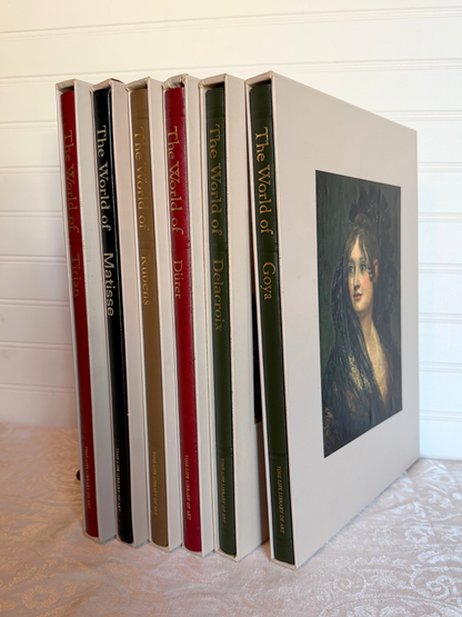 Set of books titled 'The World of' with a portrait on the cover, arranged vertically.
