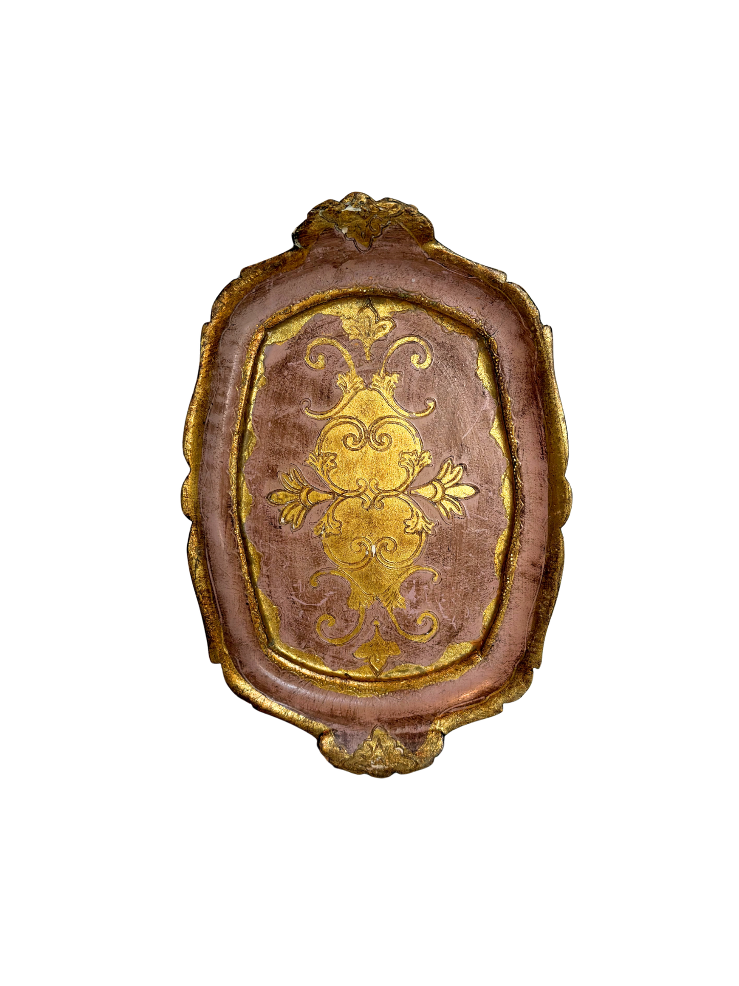 decorative pink and gold wood tray on a white background