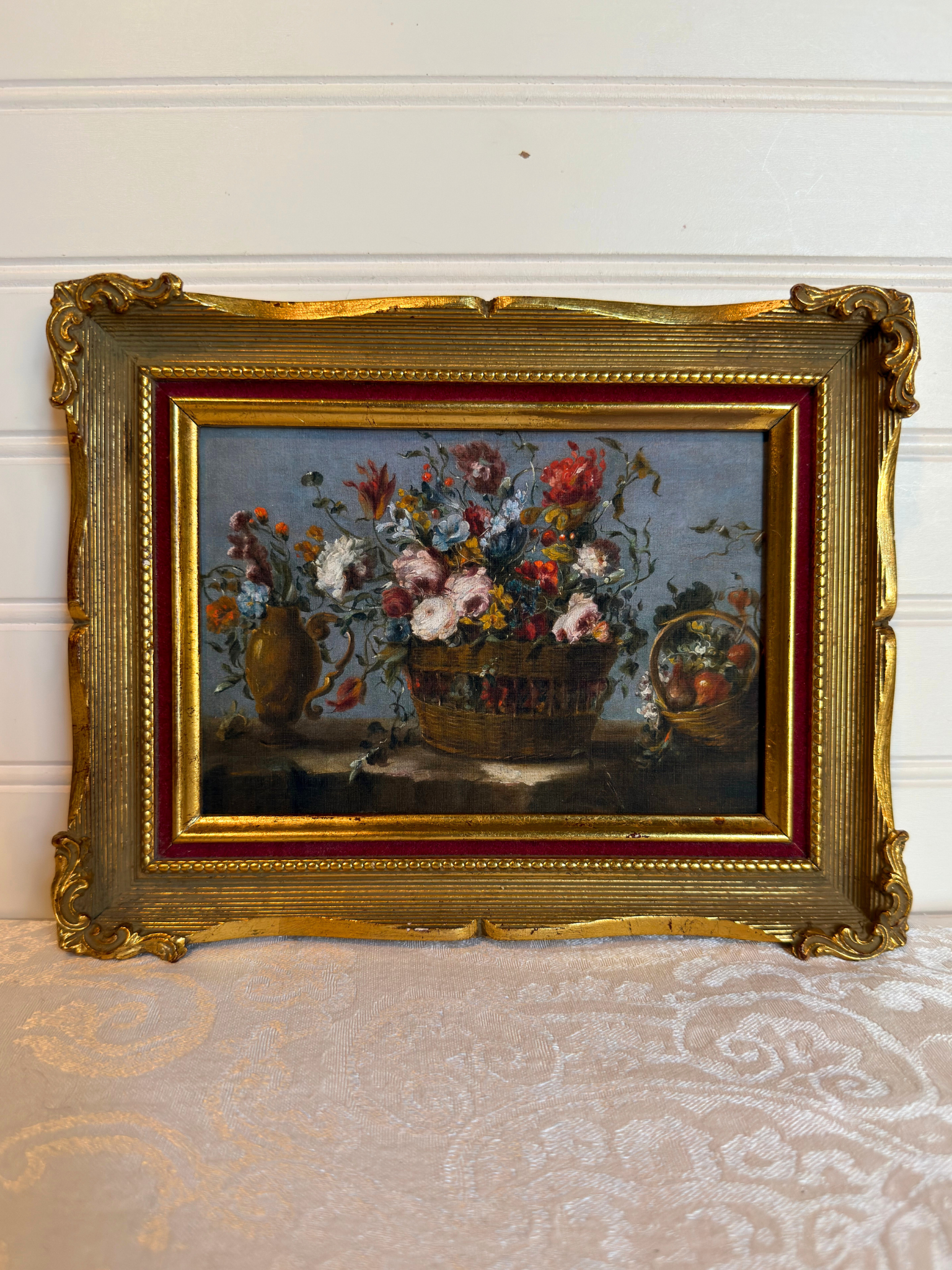 Framed print of flowers in a basket on a white background