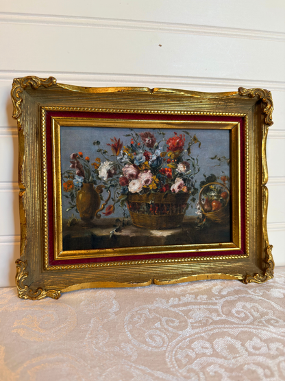 Framed print of flowers in a basket on a white background