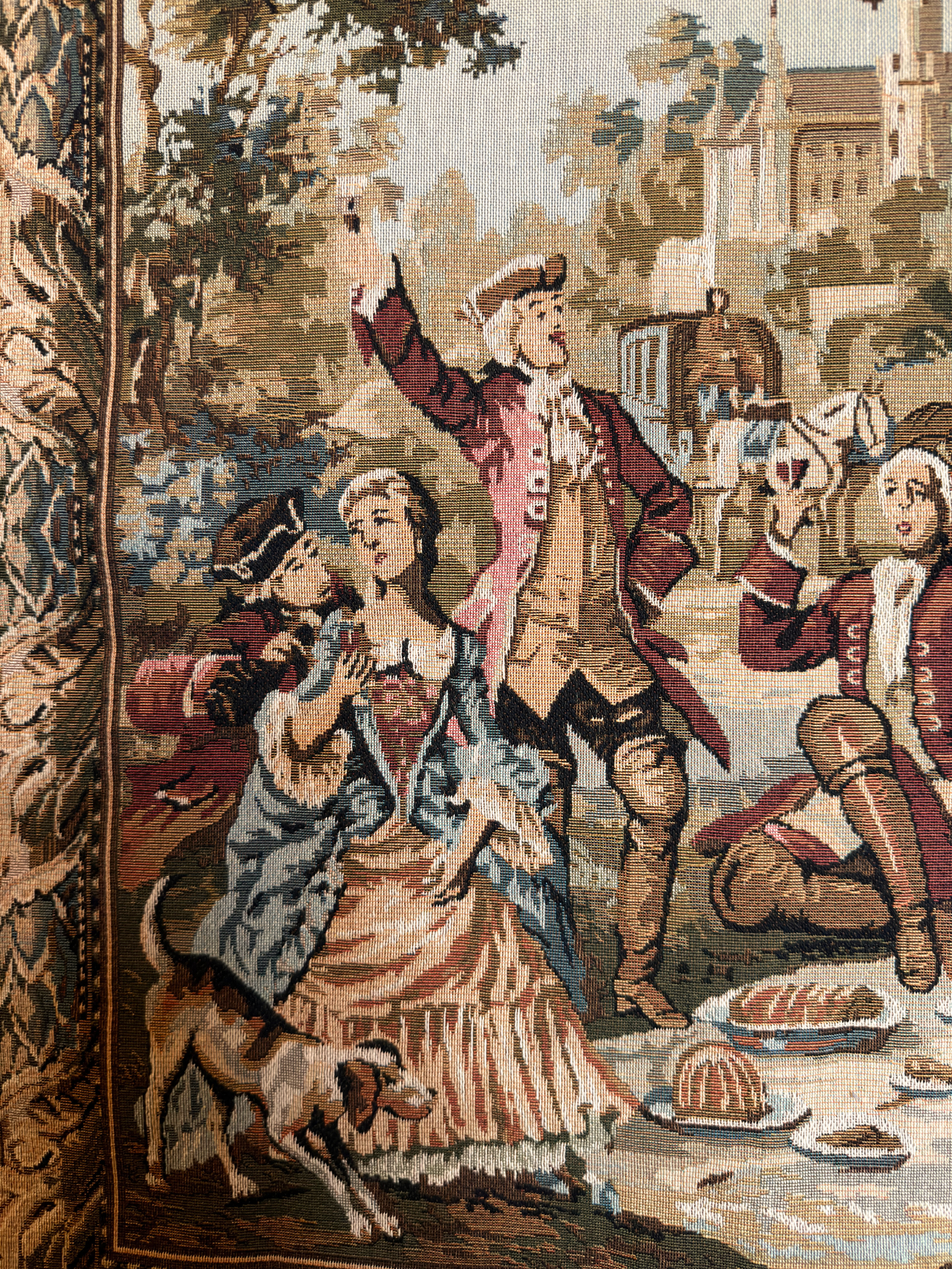 Decorative tapestry with a scene of people and a dog in a historical setting
