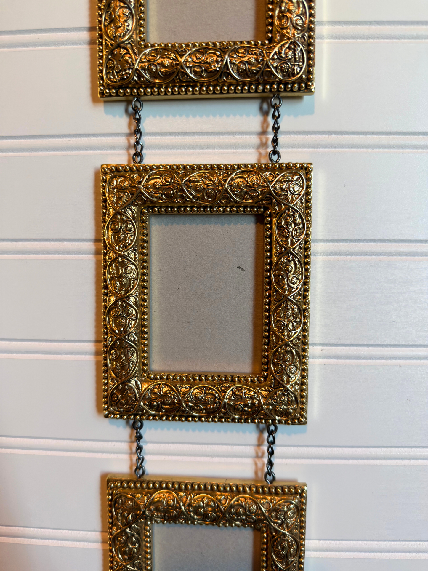 Gold Ornate Frames Connected By Chain