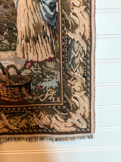 Decorative tapestry with intricate patterns and a brand logo on a white background