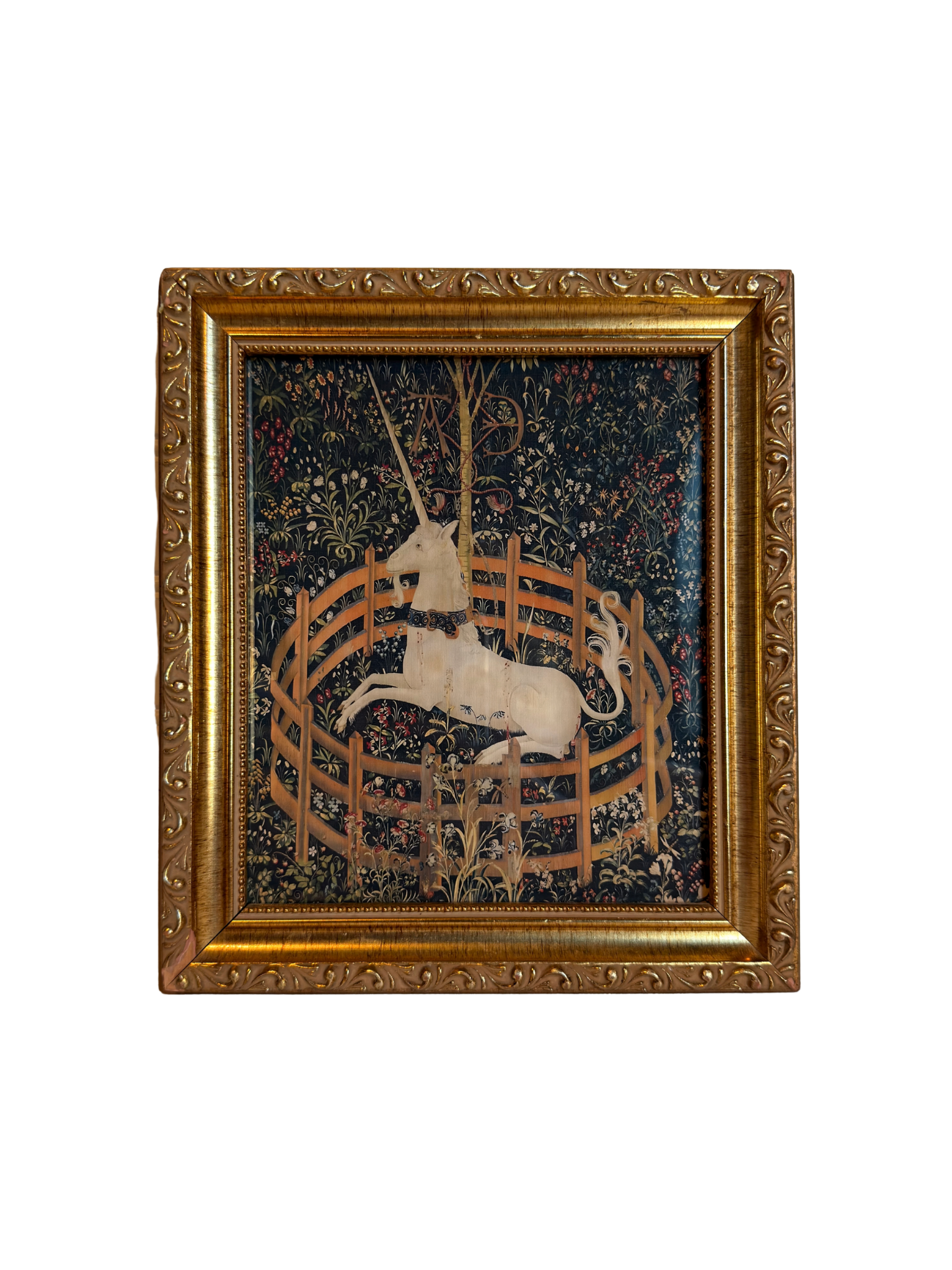 Decorative tapestry print with a unicorn in a gold frame on a white background