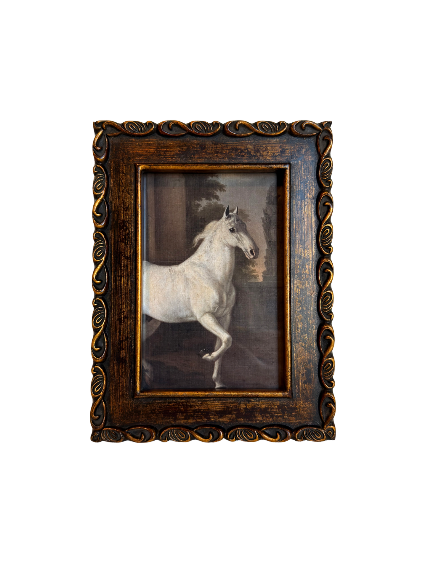 Framed print of a white horse in a bronze frame on a white background