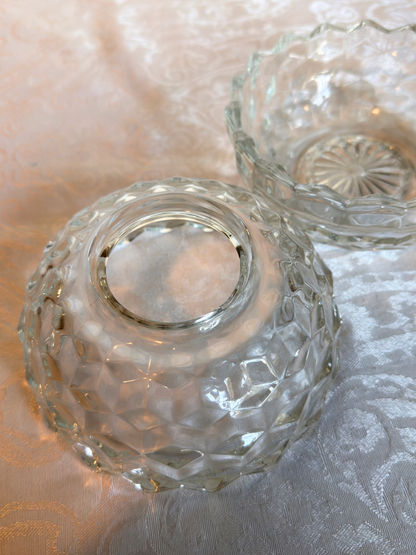 top of clear glass candle holder on a white texture surface