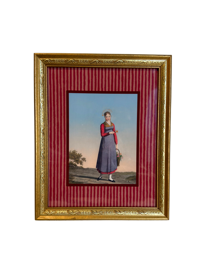 Framed artwork of a woman in a dress holding a basket on a red striped background