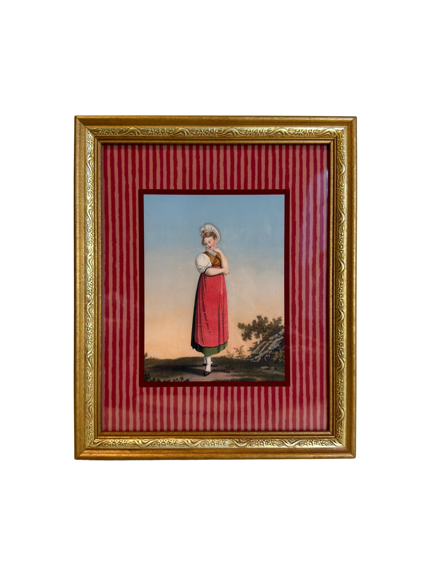 Framed artwork of a woman in a red dress, with a gold frame and red striped inner lining.