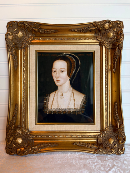 Anne Boleyn portrait in a gold frame on a white background