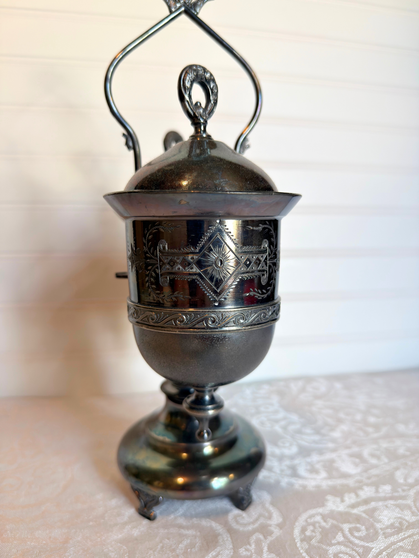 Double Silver plated Pickle castor with a figural lady on a white background