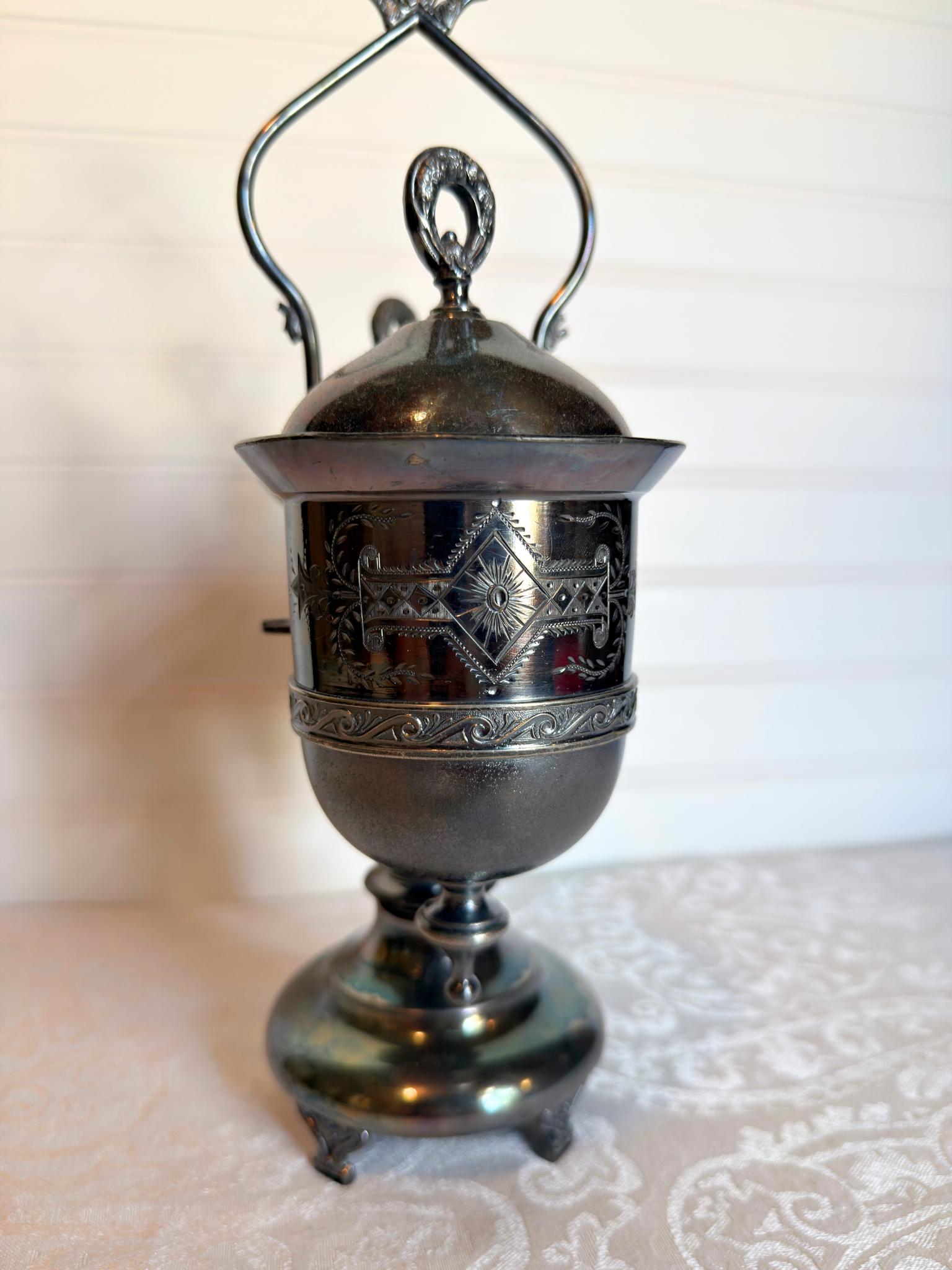Double Silver plated Pickle castor with a figural lady on a white background