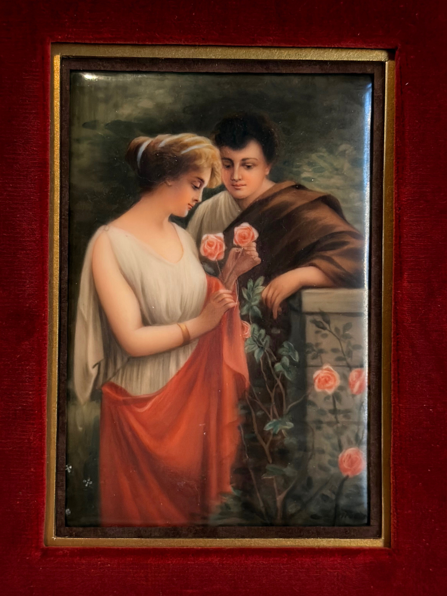 Vintage painting of a couple with flowers on a red background