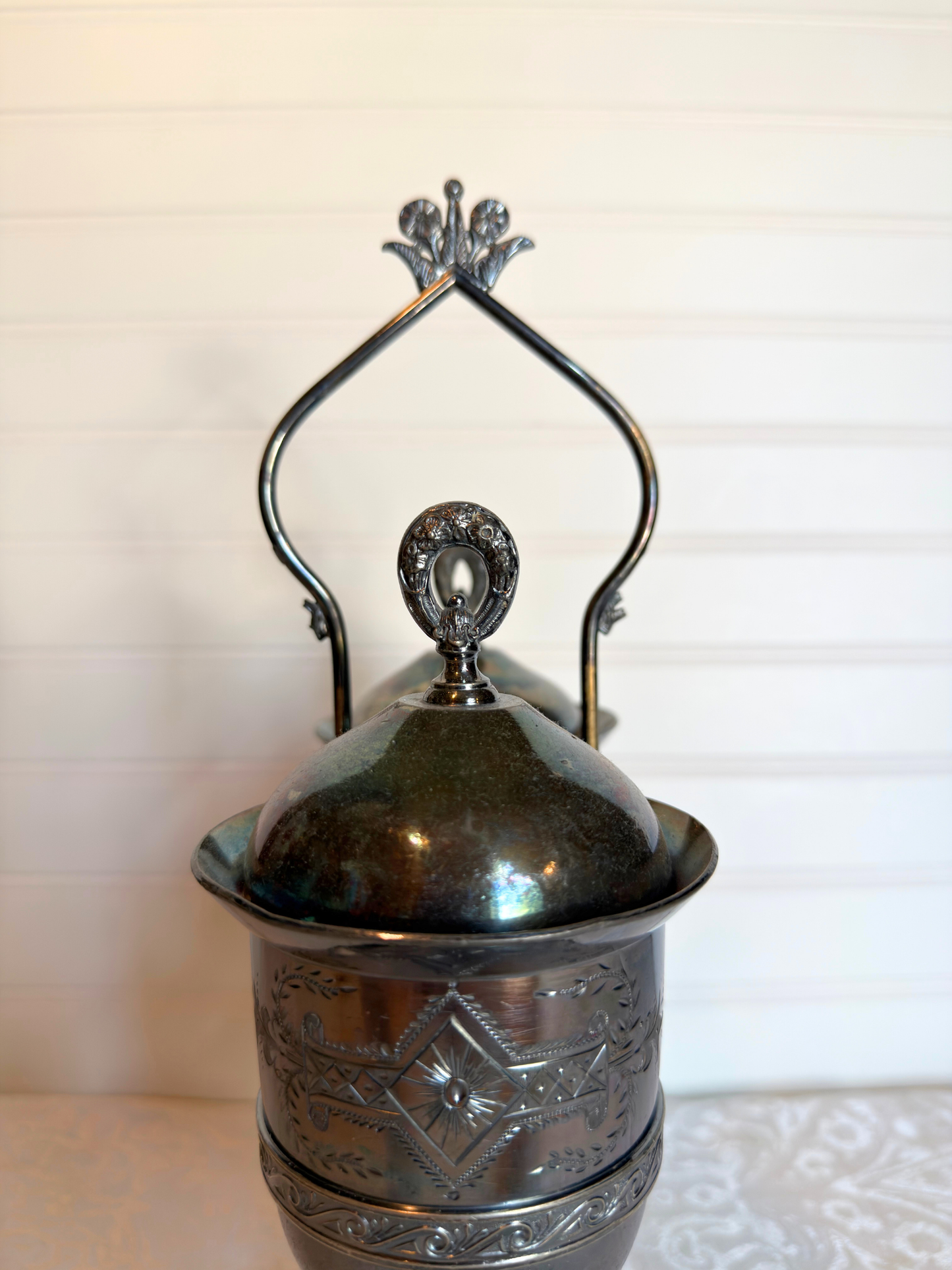Double Silver plated Pickle castor with a figural lady on a white background