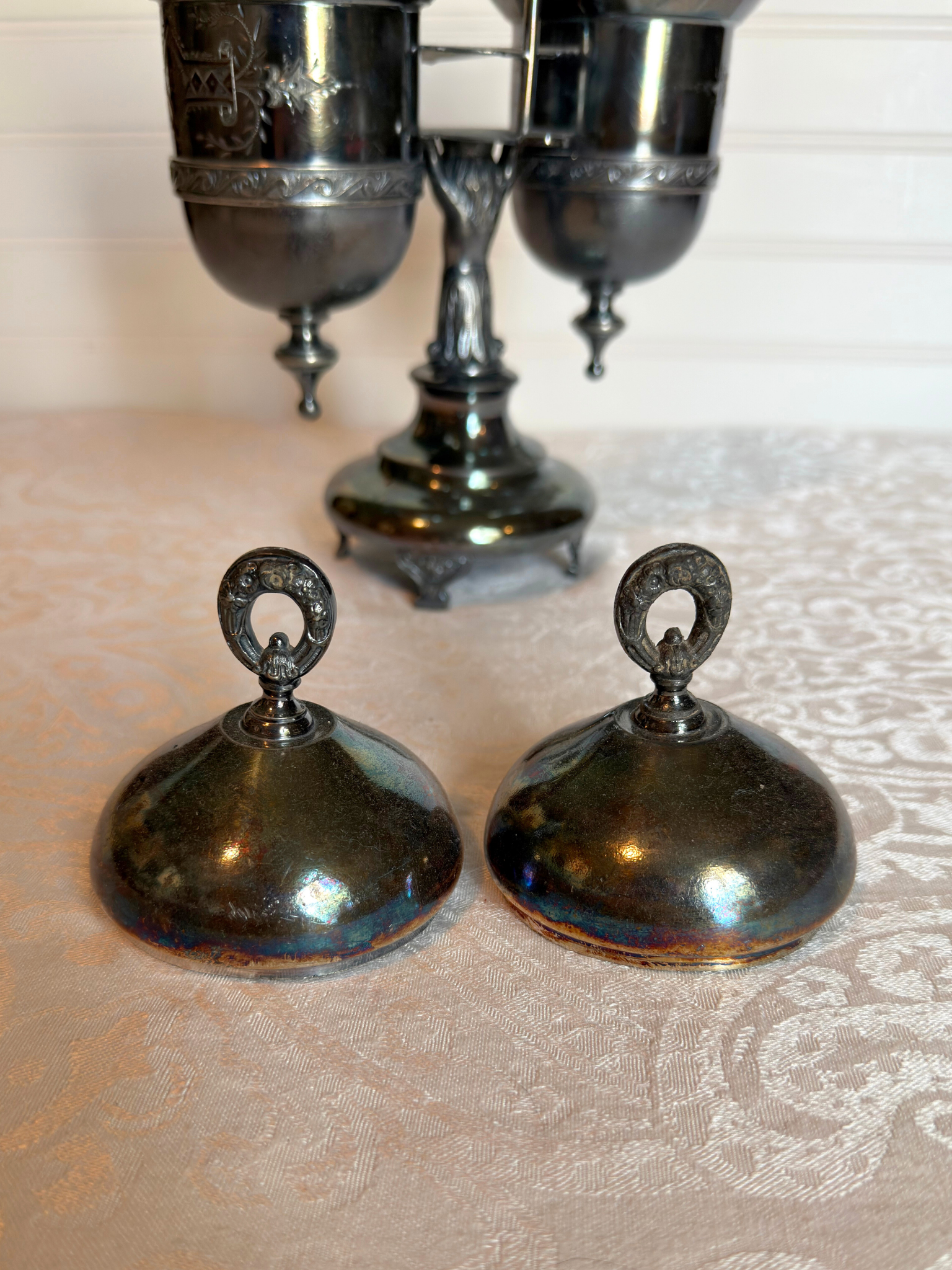 two silver plated lids of the pickle castor 