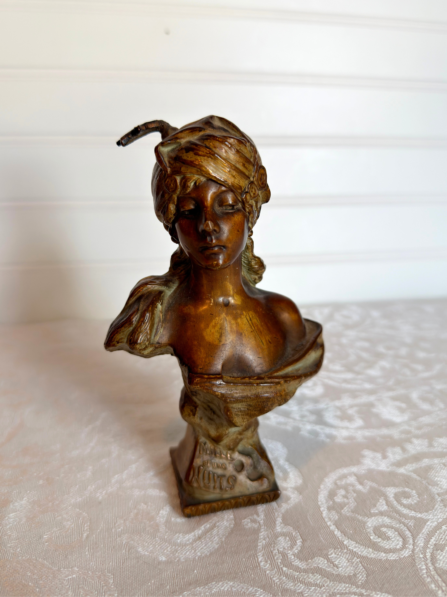 Small statue of girl on a white background