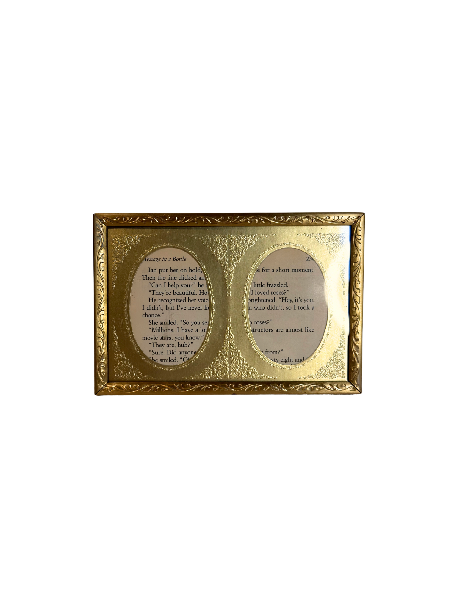 Gold-framed double oval frame with  text on a white background