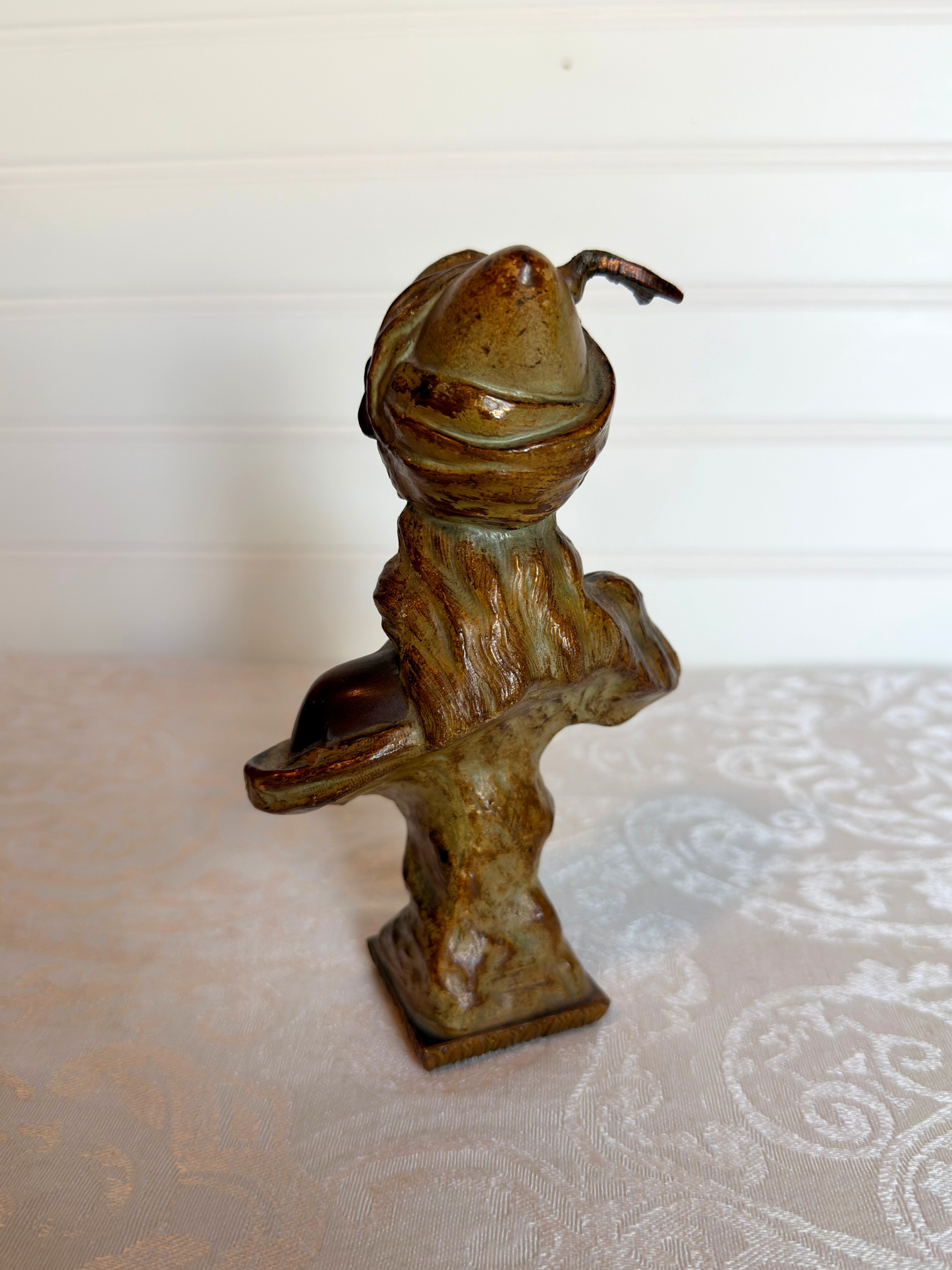 Small statue of girl on a white background