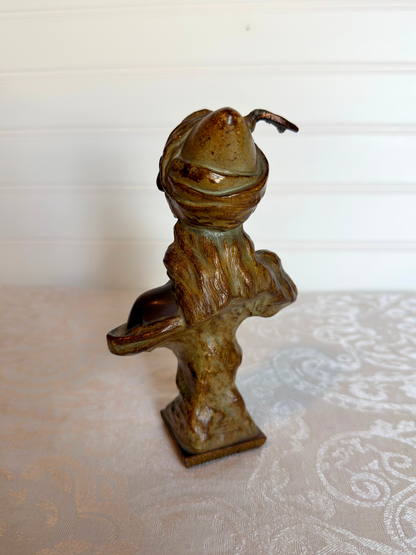 Small statue of girl on a white background