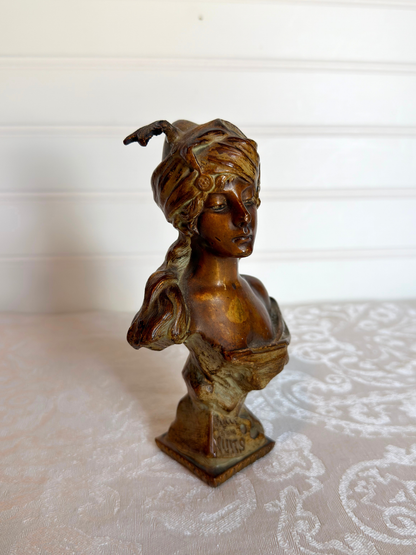 Small statue of girl on a white background