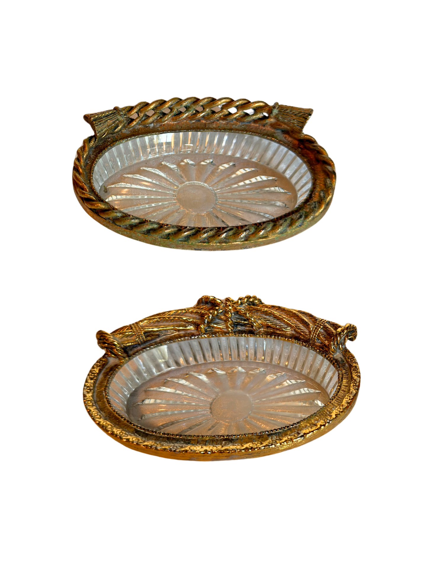 two decorative glass dish with gold rim on a textured white background
