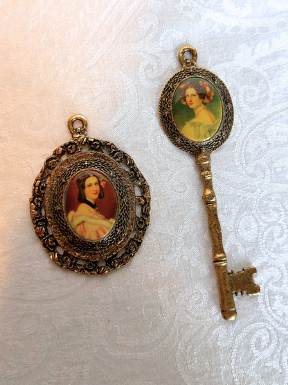 Two vintage pendants with portraits on a textured white background