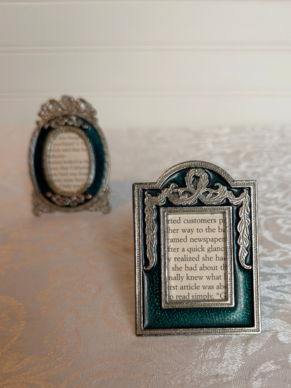 decorative teal and silver mini frames with text inside on a white background