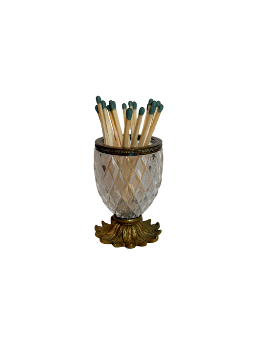 Decorative crystal  match holder with matches on a white background