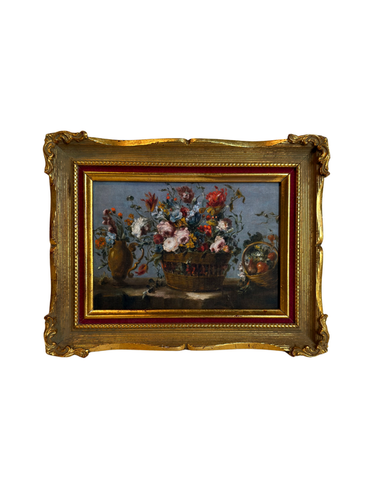 Framed print of flowers in a basket on a white background